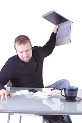 Image showing Frustrated Young Casual Businessman Working at his Desk