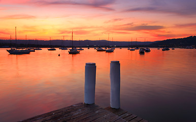 Image showing Boats on the harbour at sunset