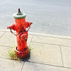 Image showing Red fire hydrant on urban street