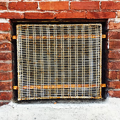 Image showing Old wire mesh protecting a basement window