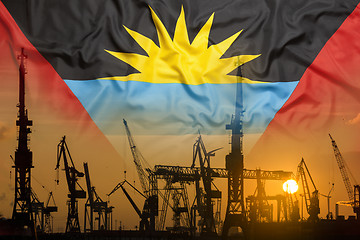 Image showing Industrial concept with Antigua Barbuda flag at sunset