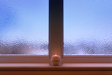Image showing Ball of yarn candle on a windowsill