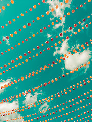 Image showing Vintage style image of colorful balls decoration against sky and