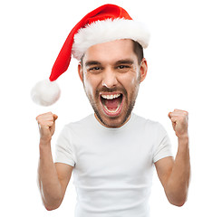 Image showing screaming man in santa hat celebrating victory