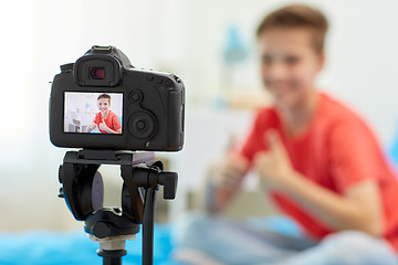 Image showing camera recording video of blogger boy at home