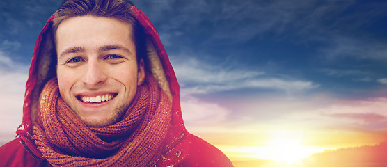 Image showing close up of happy man in winter jacket with hood