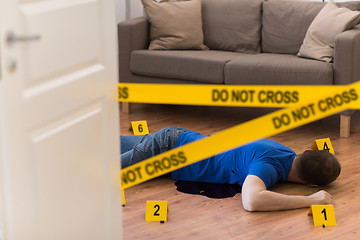 Image showing dead man body in blood on floor at crime scene