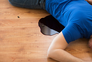 Image showing dead man body in blood on floor at crime scene