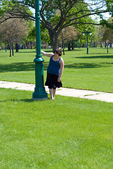 Image showing Girl Spinning Around Pole