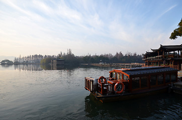 Image showing Chinese Xihu lake in Hangzhou with color boat 