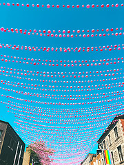 Image showing Joyful street in gay neighborhood decorated with pink balloons