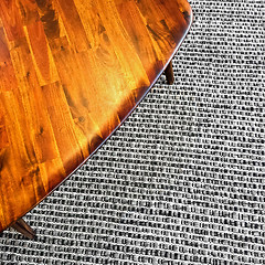 Image showing Retro style wooden table on gray rug