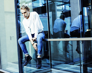 Image showing young modern hipster guy at new building university blond fashio