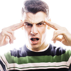 Image showing Portrait of a smart serious young man standing against white bac