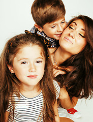 Image showing two pretty children kissing their mother happy smiling close up,