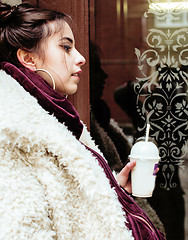 Image showing young pretty stylish teenage girl outside on city street fancy f