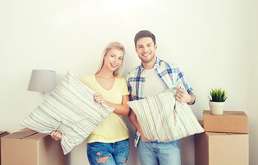 Image showing happy couple with stuff moving to new home