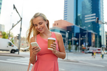 Image showing woman with coffee and smartphone in city