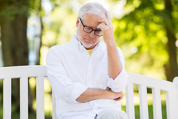 Image showing thoughtful senior man at summer park