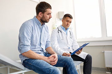 Image showing doctor and man with health problem at hospital