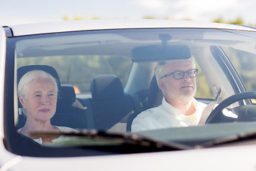 Image showing happy senior couple driving in car