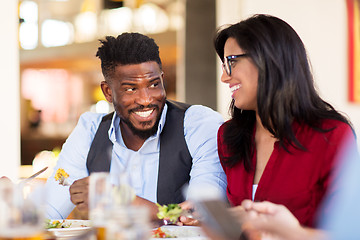 Image showing happy couple eating at restaurant