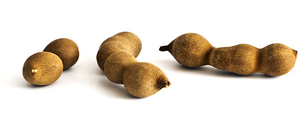 Image showing Three raw tamarind fruits