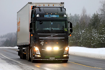 Image showing Black Volvo FH Semi Headlights in Winter