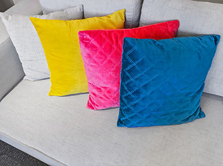 Image showing Multicolored cushions decorating a gray sofa