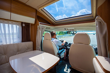 Image showing Man driving on a road in the Camper Van RV