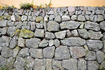 Image showing Wall of rough and stacked stones 