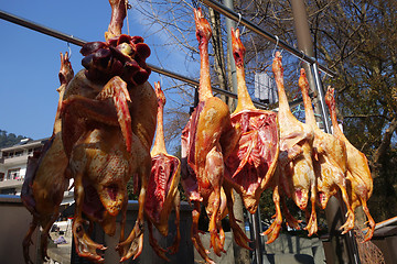 Image showing The meat drying outside on the sun