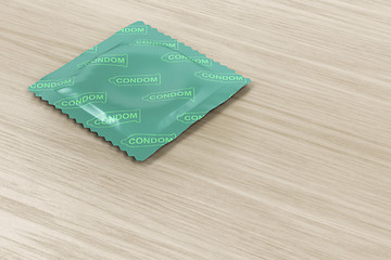 Image showing Condom on wood background