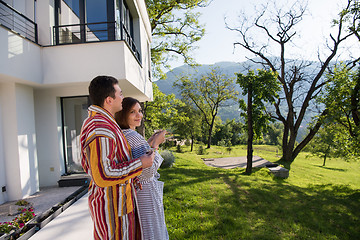 Image showing Young beautiful couple in bathrobes