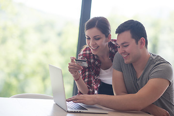 Image showing happy young couple buying online