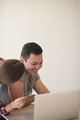 Image showing happy young couple buying online