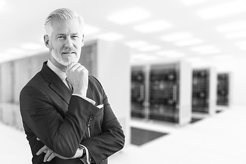 Image showing Senior businessman in server room