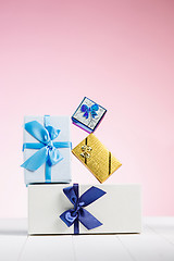 Image showing Gift box wrapped in recycled paper with ribbon bow