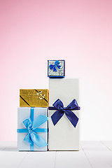 Image showing Gift box wrapped in recycled paper with ribbon bow