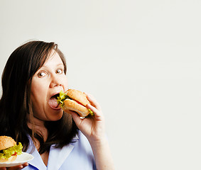 Image showing fat white woman having choice between hamburger and salad