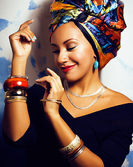 Image showing beauty bright african woman with creative make up, shawl on head like cubian closeup