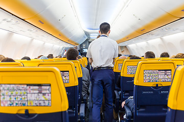 Image showing Interior of commercial airplane during flight.