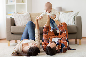 Image showing happy family playing with baby at home