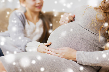 Image showing close up of pregnant woman and girl at home