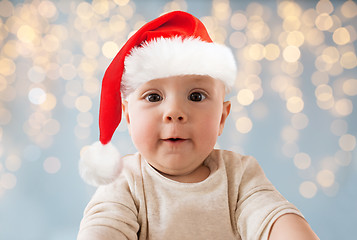 Image showing close up of little baby in santa hat at christmas