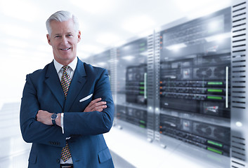 Image showing Senior businessman in server room