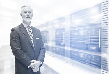 Image showing Senior businessman in server room