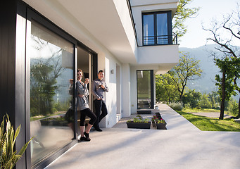 Image showing couple enjoying on the door of their luxury home villa