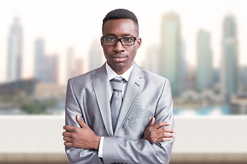 Image showing Young black businessman in front of the big city