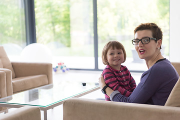 Image showing mother and cute little girl enjoying their free time